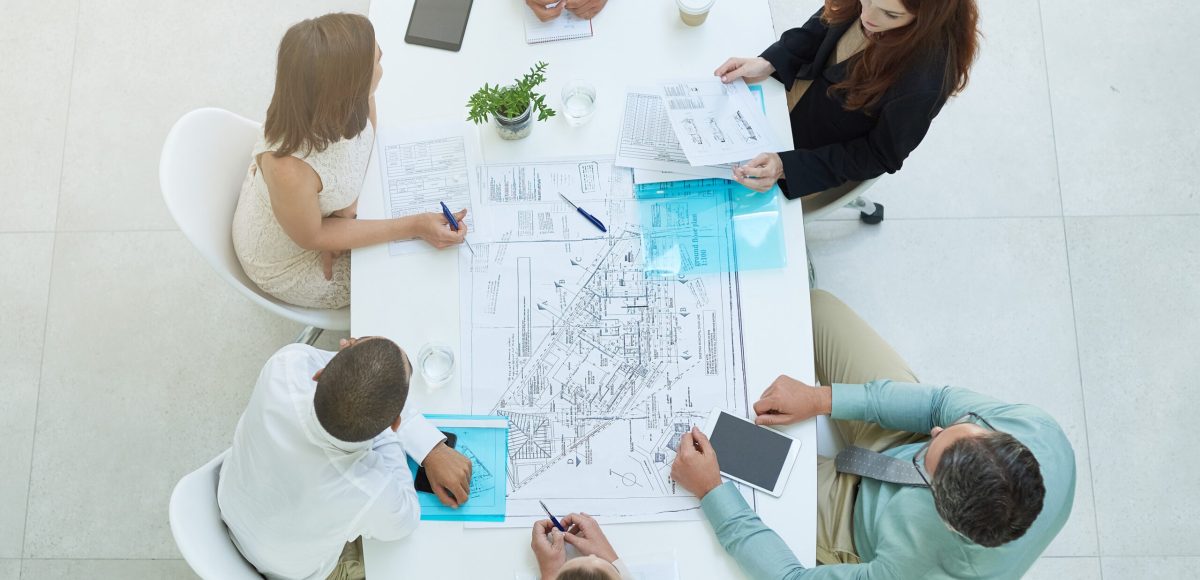 Theyre a dedicated group. High angle shot of a group of businesspeople meeting in the office